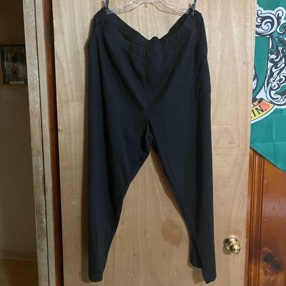 Woman within black pants.